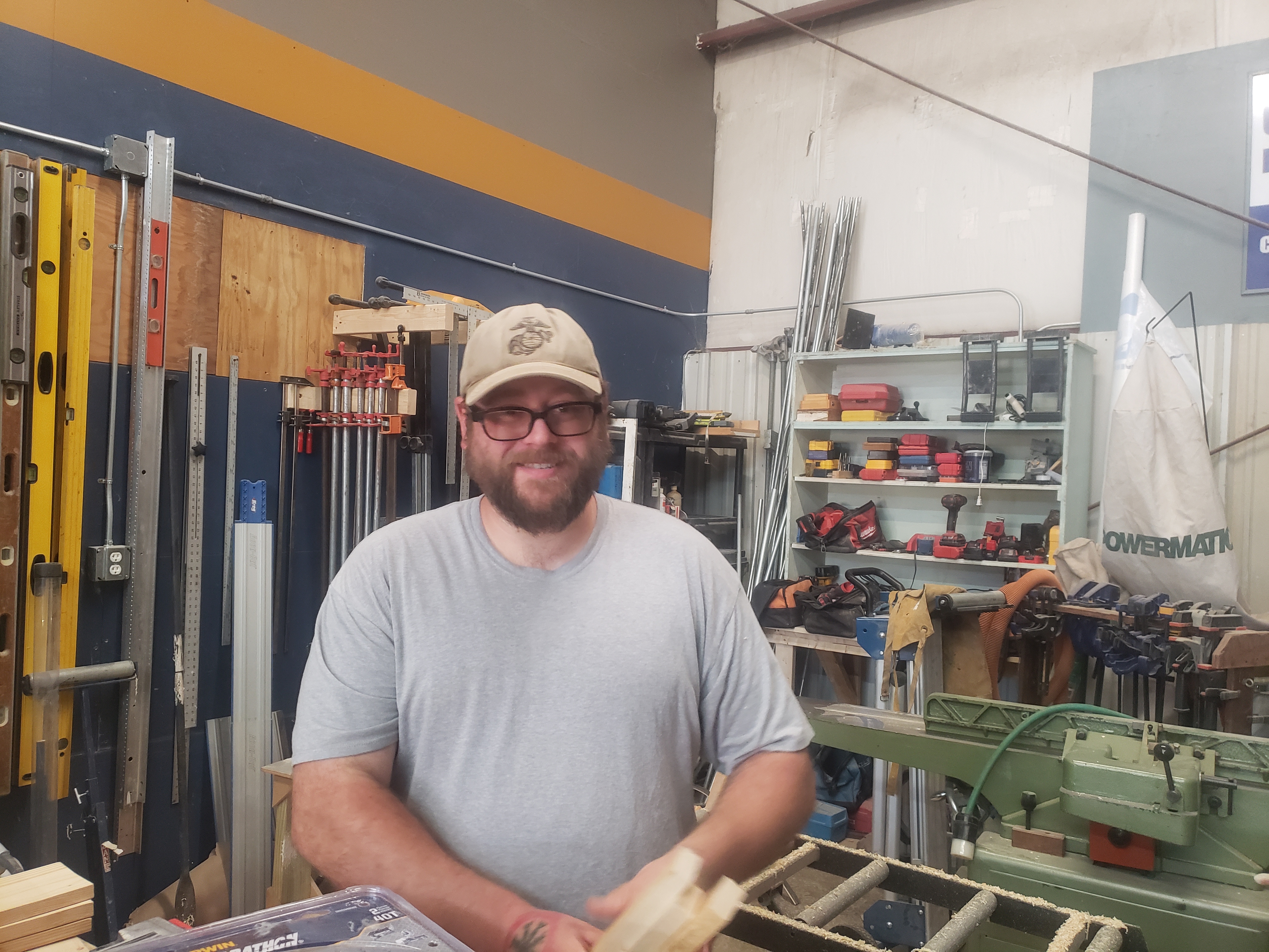 Veteran learning skilled trades in workshop